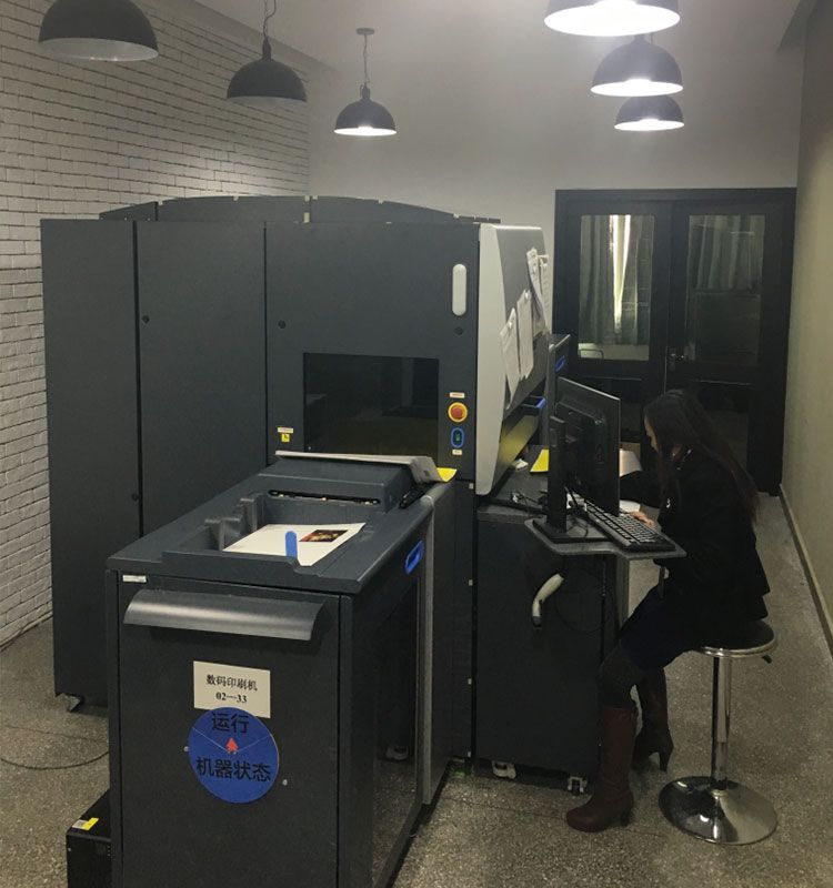 Digital printer operated by worker