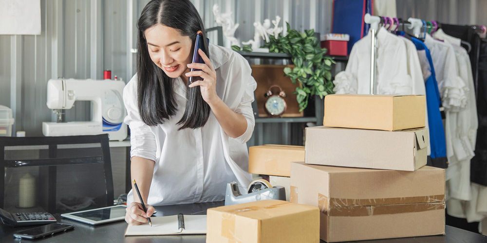 Woman taking notes for shipping