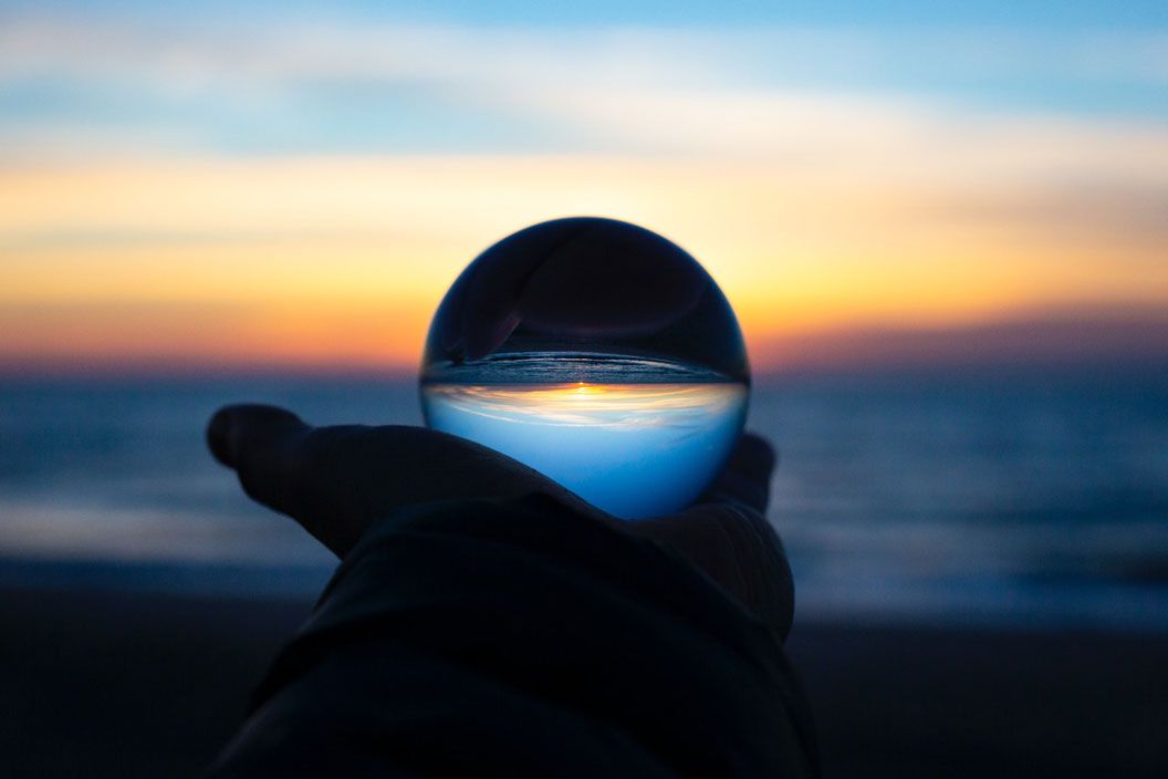 Crystal ball held on hand palm